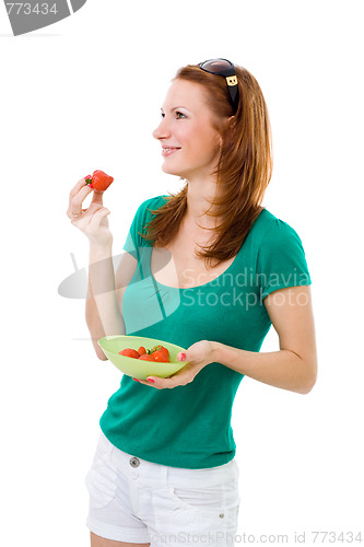 Image of Woman eating strawberry