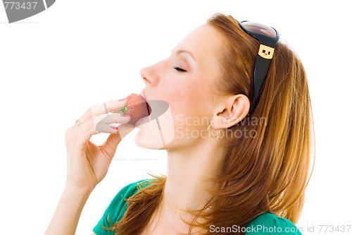 Image of woman eating tasty strawberries