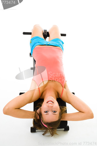 Image of exercising on prelum bench