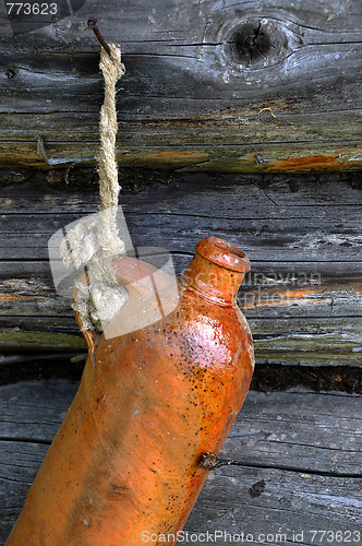 Image of Old Ceramic Bottle On The Wall