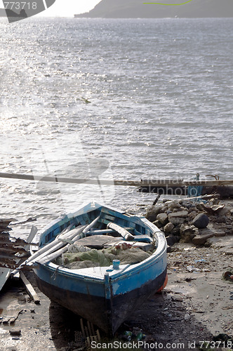 Image of hand built native fishing boat on shore bequia