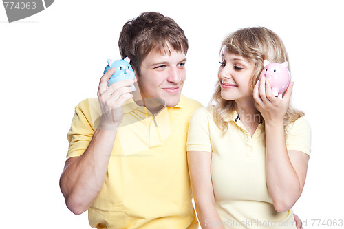 Image of Young couple saving money