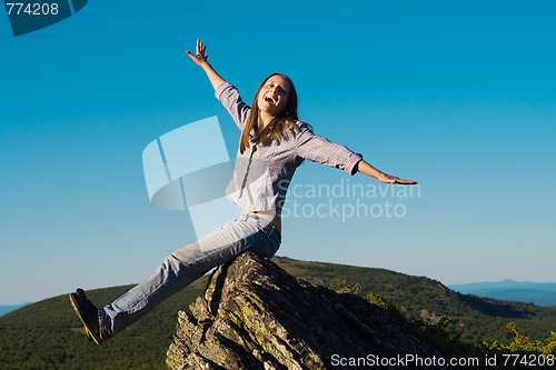 Image of Woman on top of the wold