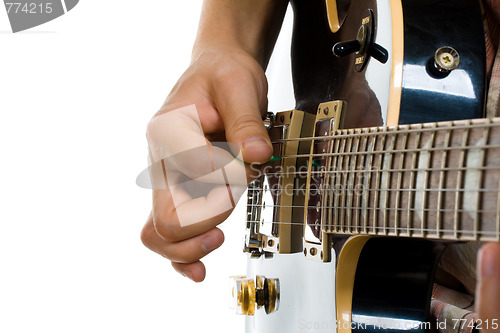 Image of How to hold guitar pick