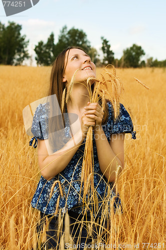 Image of woman farmer with wheat