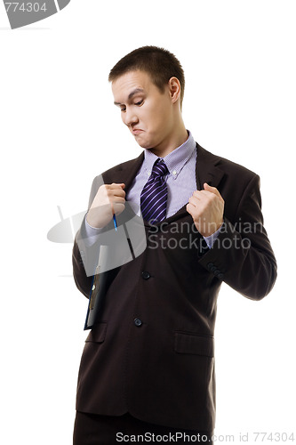 Image of Young man in formal suit tear it apart because of wrong size