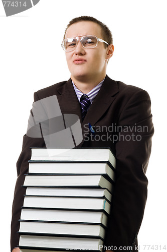 Image of Young man carry pile of books