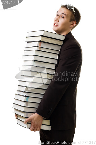 Image of Student with many books tired