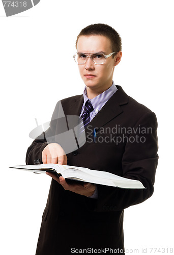 Image of Clever man with huge book in glasses