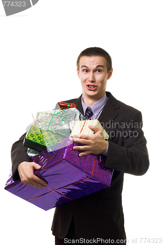 Image of Young crazy man with many presents 