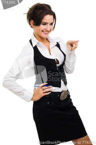 Image of Woman pointing with finger and laughing wearing formal clothes