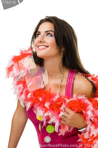 Image of Young woman sitting with red feather