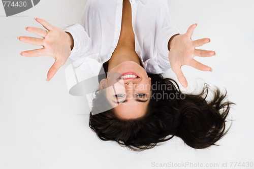 Image of Woman smile and stretch out hands - top view
