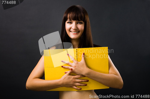 Image of Sexy young woman with yellow