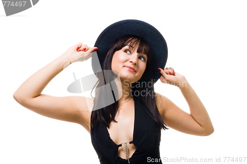 Image of Young friendly woman smile and hold big hat