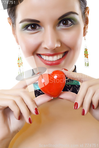 Image of young pretty girl holding heart