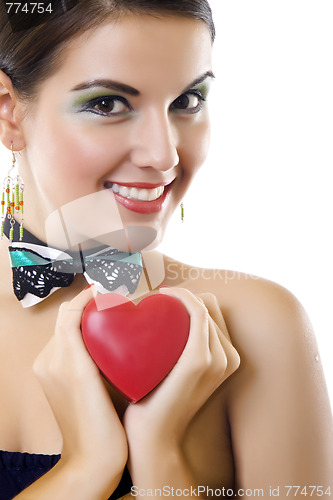 Image of beautiful woman holding a love symbol in hands