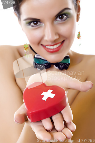 Image of Beautiful young woman holding a red heart