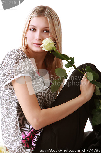 Image of Girl sitting with yellow rose