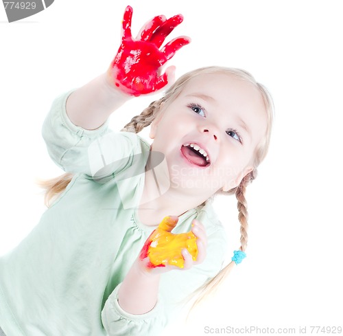 Image of Little girl playing with colors