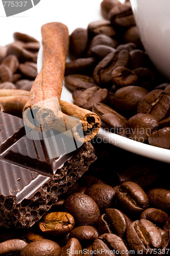 Image of chocolate, coffee beans, cinnamon sticks and cup