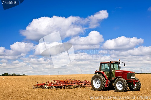 Image of Tractor in plowed field