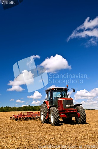 Image of Tractor in plowed field