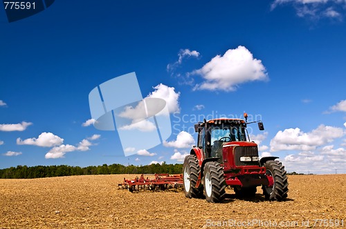 Image of Tractor in plowed field