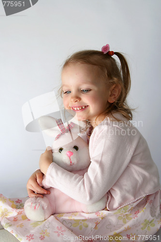 Image of Baby girl and pink bunny