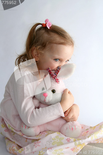 Image of Baby girl and pink bunny