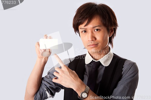 Image of Asian business man pointing at white card