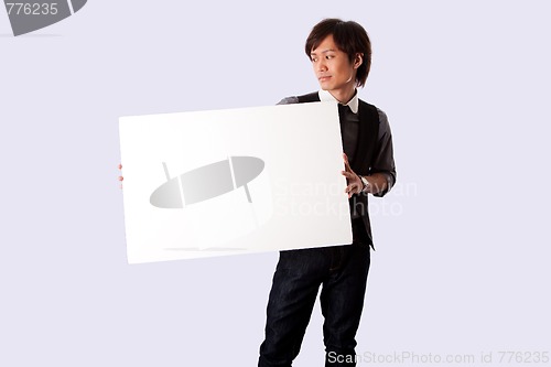 Image of Young business man with white board