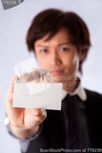 Image of Asian business man with white card