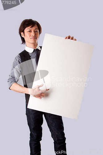 Image of Asian business man pointing at white board