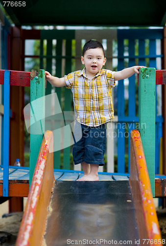 Image of boy ready to slide