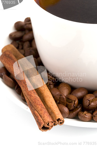 Image of cup of coffee, cinnamon and beans