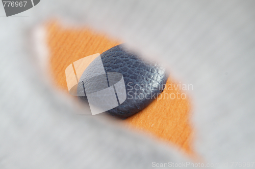 Image of View of button through a buttonhole