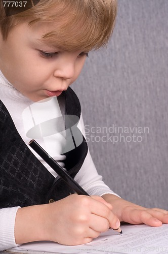Image of Boy writing