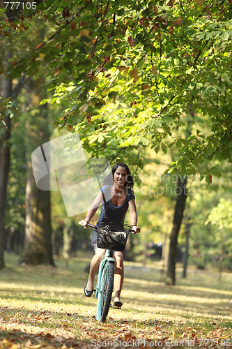 Image of Woman riding a bicycle