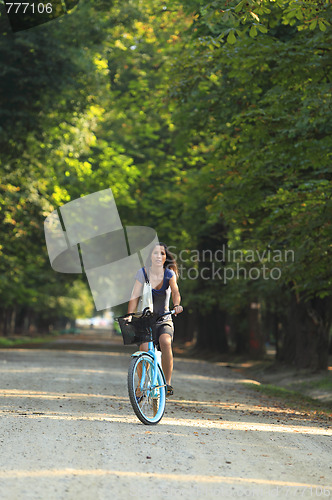 Image of Woman riding a bicycle