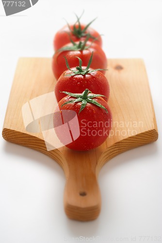 Image of tomatoes on wooden board