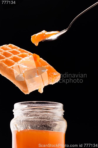 Image of jam, waffle and tea spoon