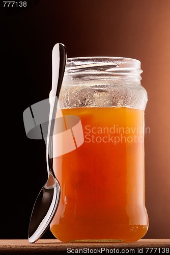 Image of apricot jam and tea spoon