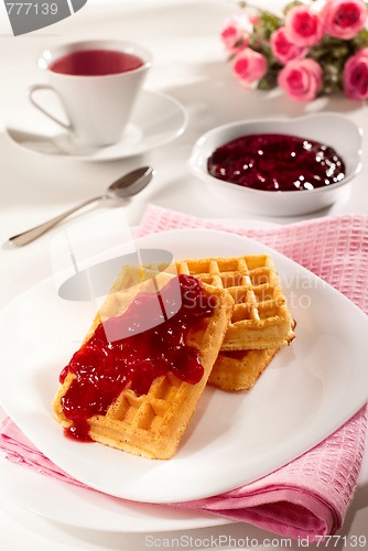 Image of Belgian waffles, jam and tea 