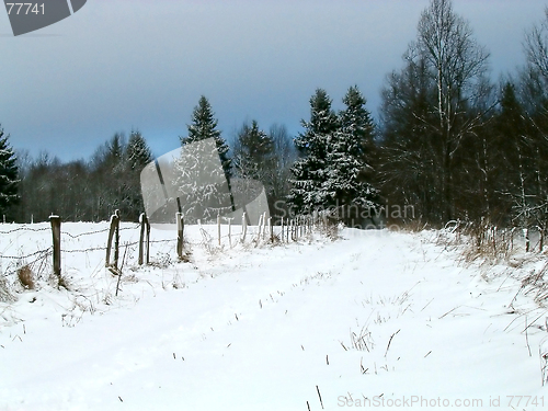 Image of winter road near fence