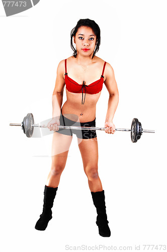 Image of Young girl lifting weight.