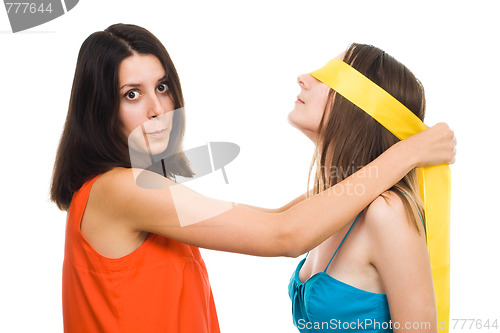 Image of Two young women play blind