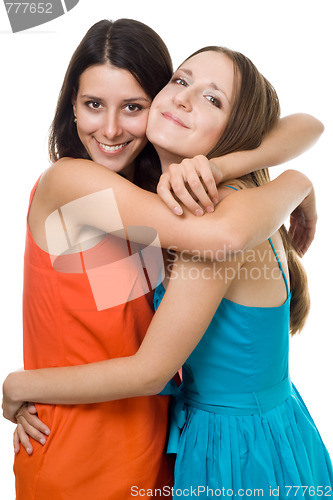 Image of Two young woman embrace and smile