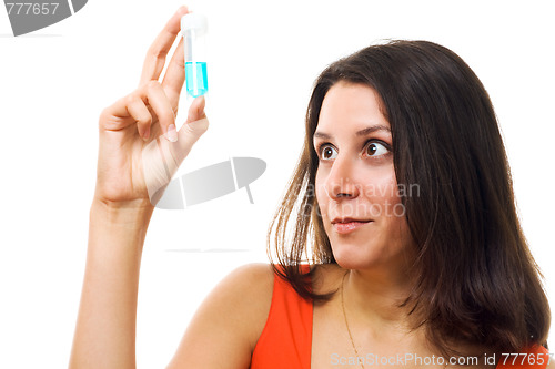 Image of Surprised woman examine test tube
