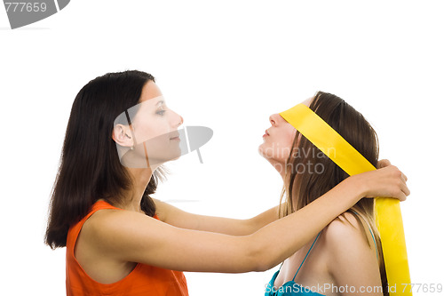 Image of Two women friends play with fillet